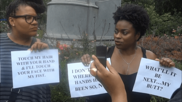 Advocates in Union Square express distaste at a natural hair demonstration. -Video by Ramelcy Uribe